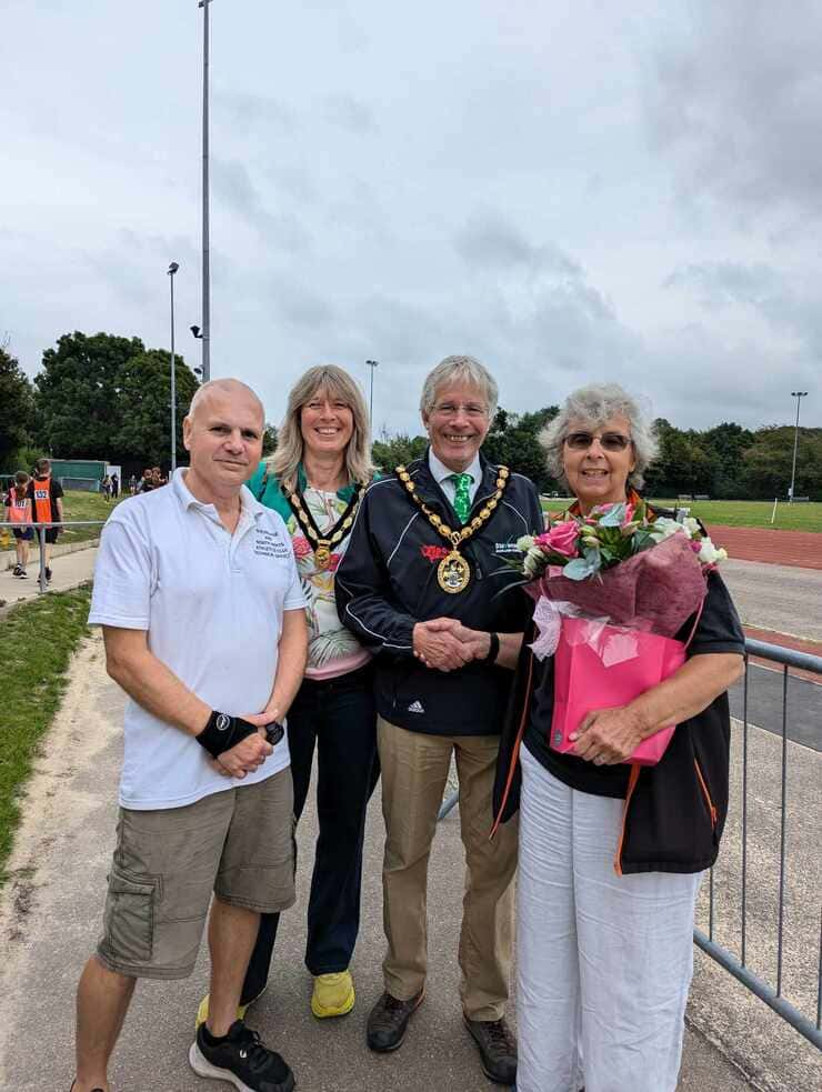 Presentation to Norma Harris long serving retiring secretary at the Stevenage and North Herts Athletics Club annual championships Ridlins with club chair Paul Pickard Mayor Jim and Mayoress Penny